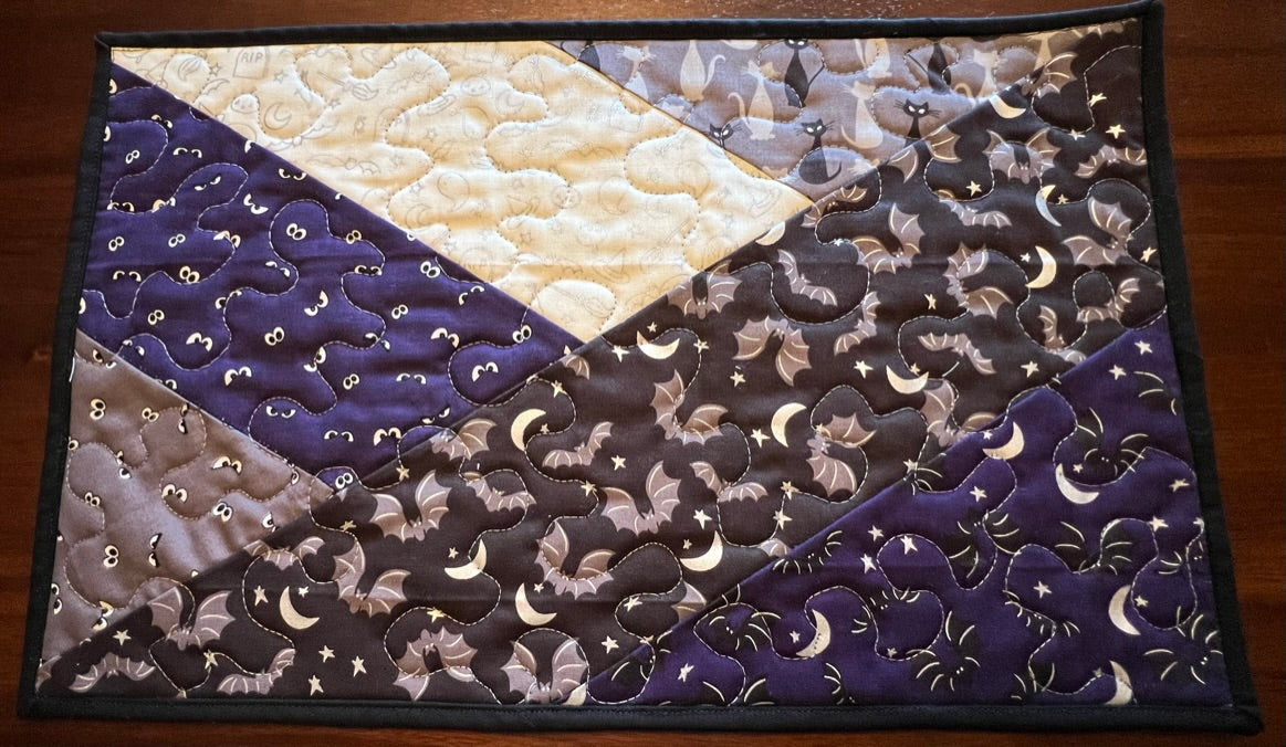 Halloween placemat/table runner set. Made in the Maritimes, this high-quality set will dazzle your table for all spooky guests.